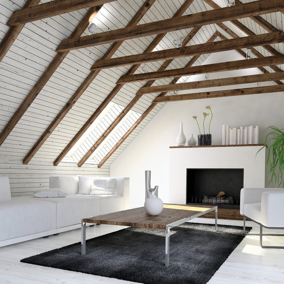 Cozy monochromatic white living room or den in a converted attic Attic Conversions